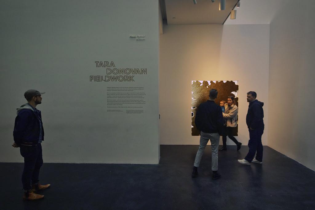 A photographer capturing an event at the High Museum of Art in Atlanta