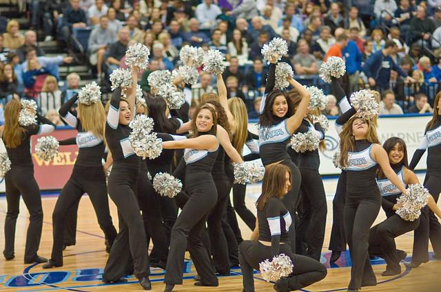 A dynamic shot of the Boston University Dance Team during a competition
