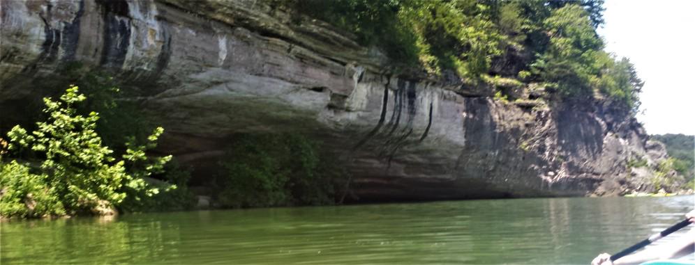 Scenic view of the Buffalo National River with towering bluffs and rock formations