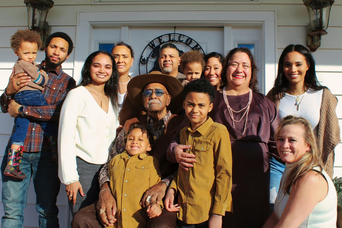 A candid and heartwarming outdoor family portrait capturing genuine emotions.