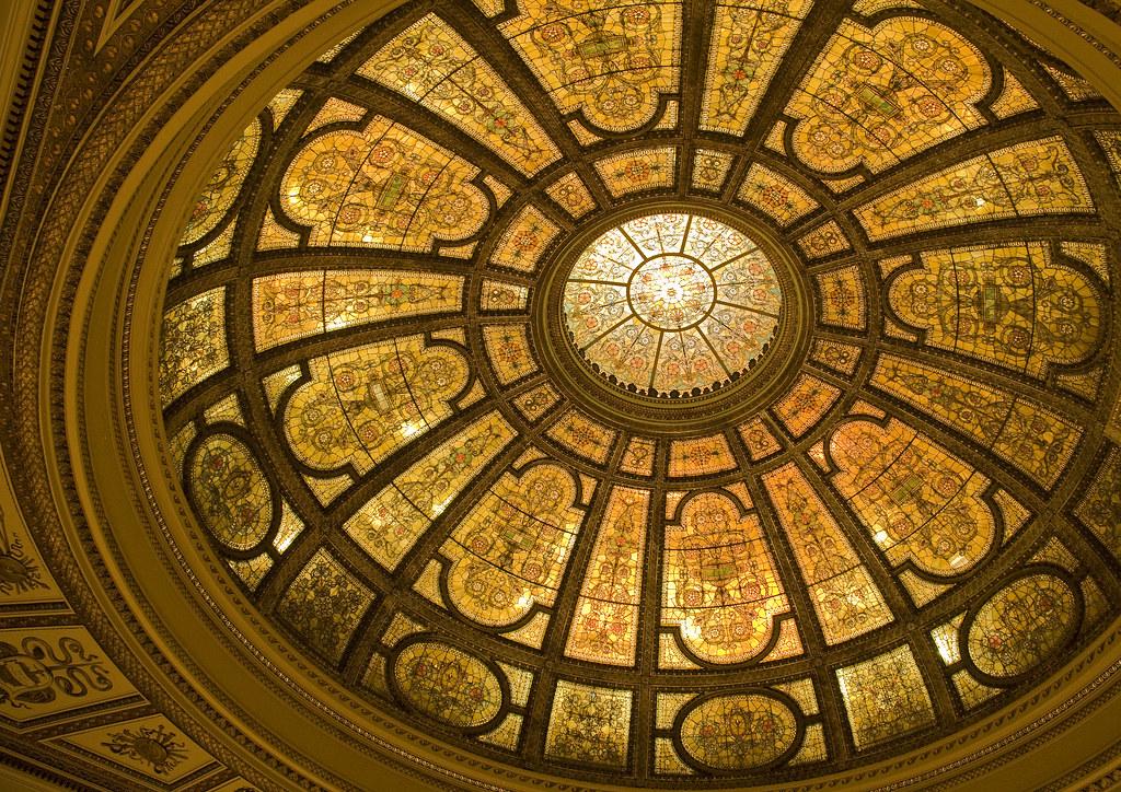 The stunning Tiffany glass dome inside the Chicago Cultural Center, with intricate mosaics and ornate details
