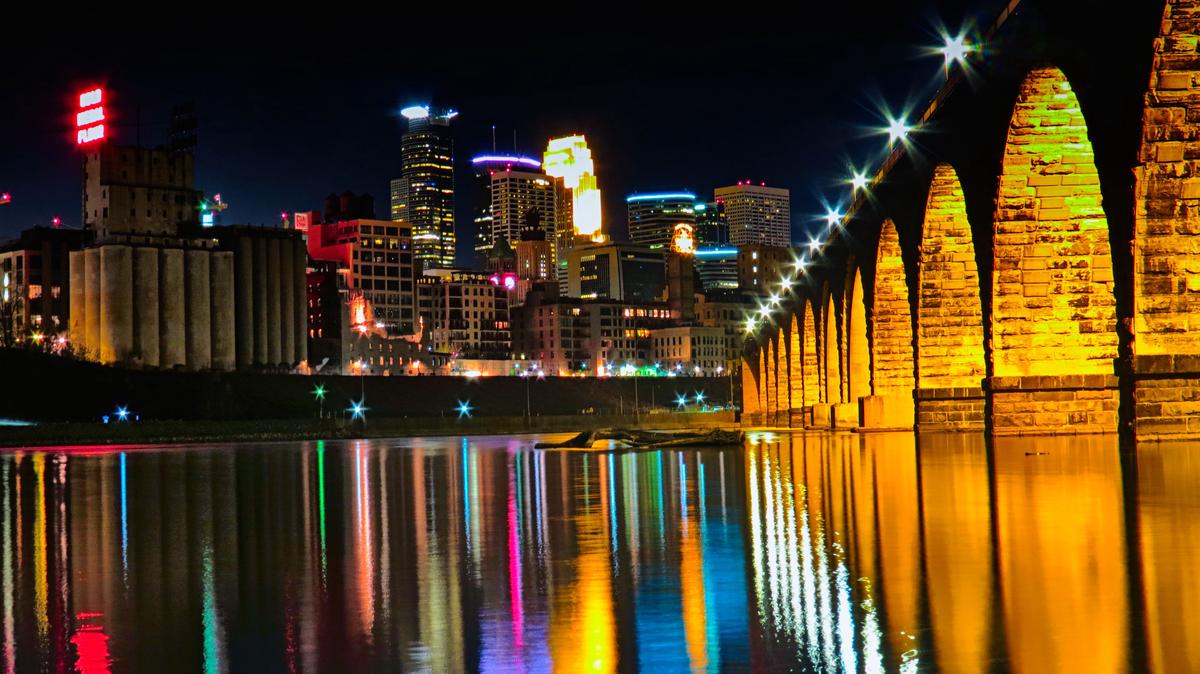 A collage of popular Minneapolis engagement photo locations including Stone Arch Bridge, Minnehaha Falls, and the Sculpture Garden