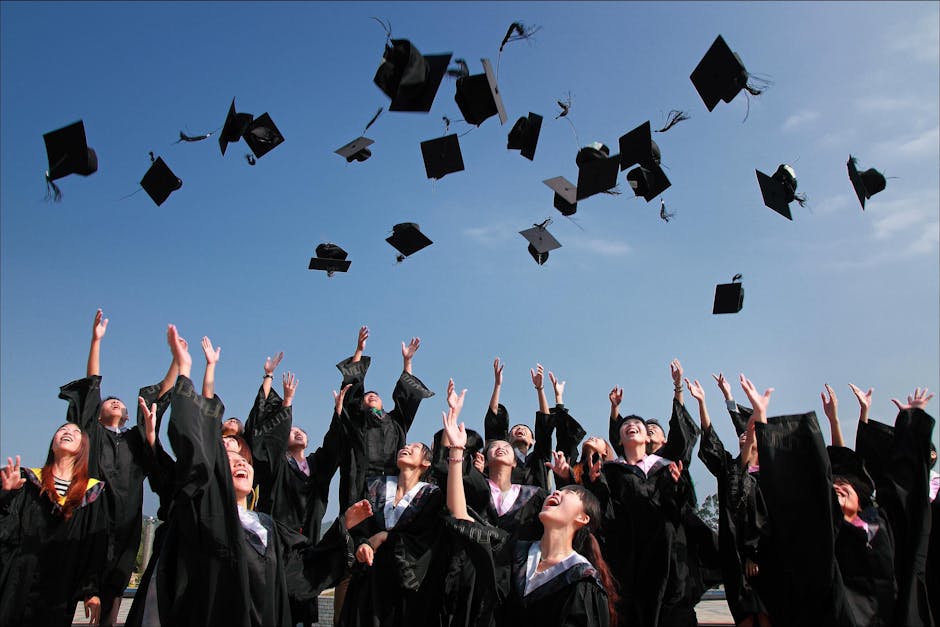 A joyous scene from a Boston University commencement ceremony with graduates celebrating