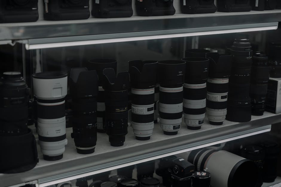 An array of professional camera equipment for corporate event photography, including cameras, lenses, and lighting