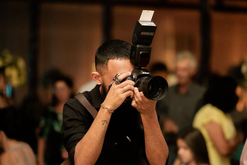 Donald Stokely, a prominent Tampa photographer, capturing a candid moment at a lively event