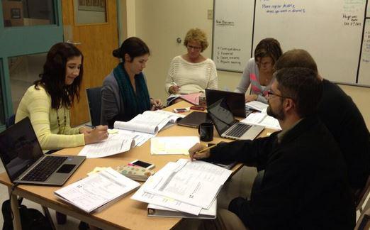 Employees collaborating during a workshop at a corporate event