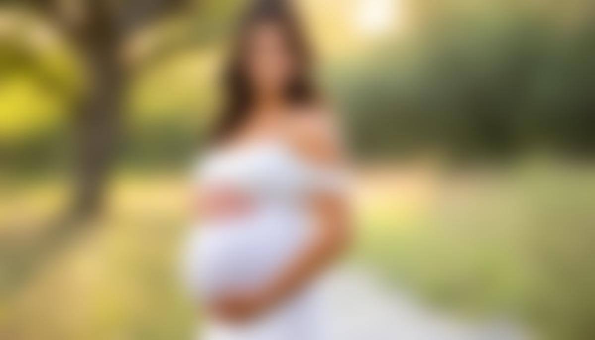 An expectant mother poses for a beautiful outdoor maternity photo session in San Antonio.