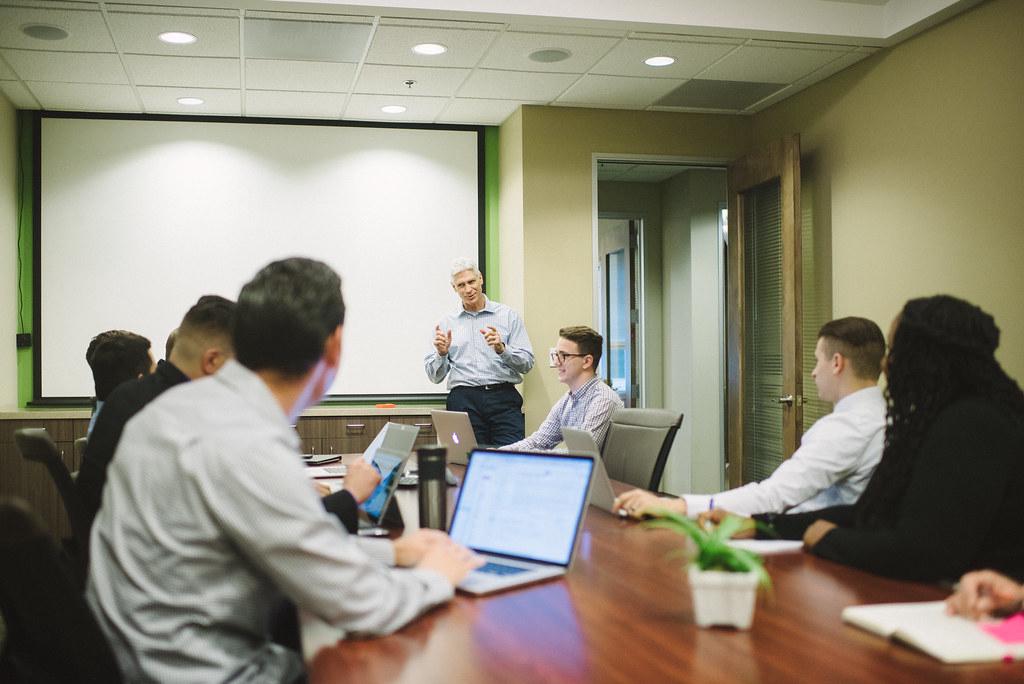 An event photographer capturing a corporate meeting in a Denver venue