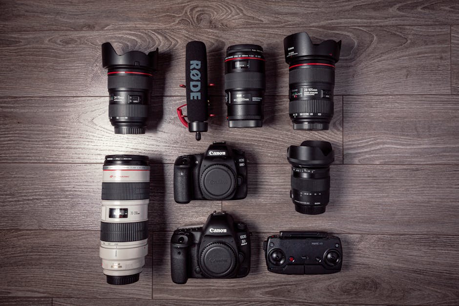 A collection of high-end event photography equipment including cameras, lenses, and lighting
