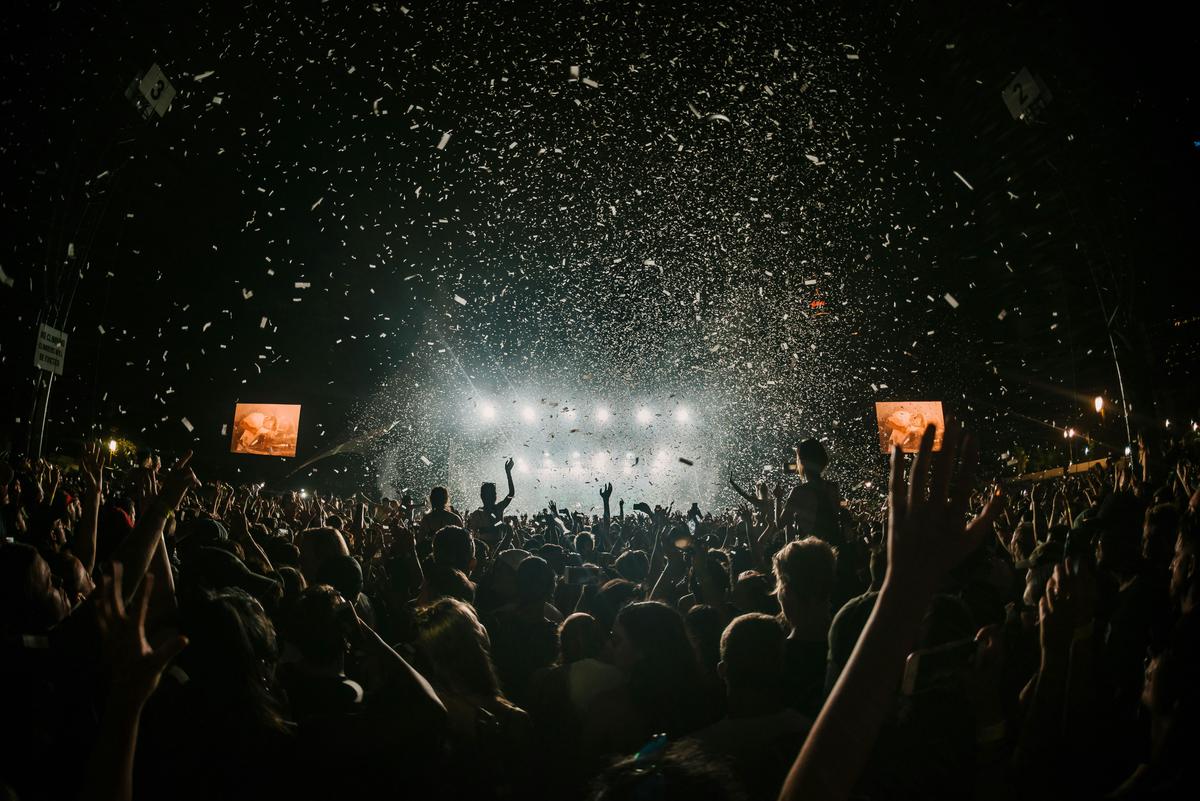 A visual representation of festival photography etiquette and best practices, including respecting attendees' privacy, obtaining necessary permissions, and maintaining a low profile while capturing authentic moments.