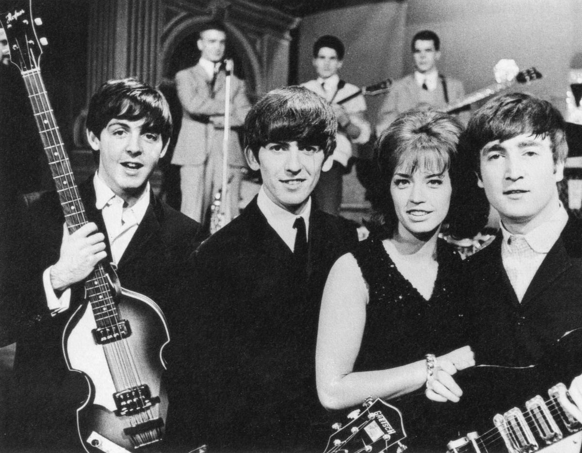 A candid photograph taken by Paul McCartney showing The Beatles during their early rise to fame in the 1960s