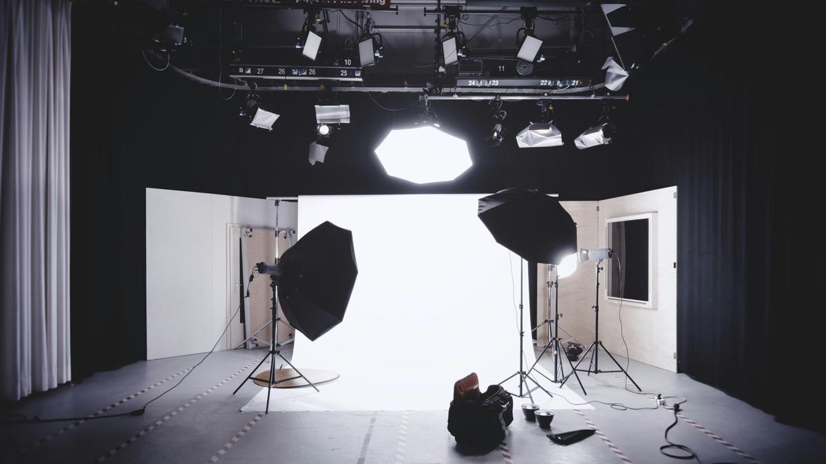 A modern portrait photography studio in Minneapolis with various backdrops and lighting setups