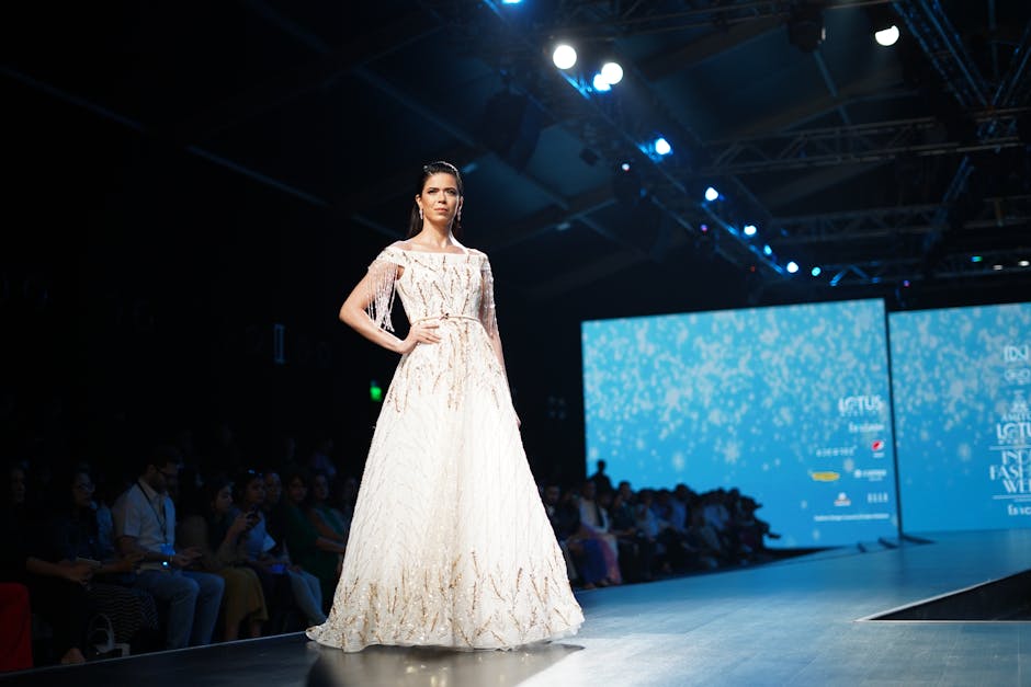 A fashion photographer captures a model on the runway during a Las Vegas fashion show, showcasing their technical skill and artistic vision.