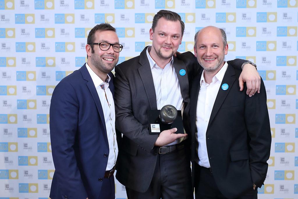 A company newsletter or intranet page featuring vibrant photos from a recent corporate event, boosting employee morale and engagement.