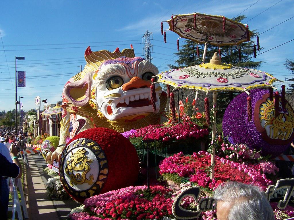The Grand Floral Parade of the Portland Rose Festival with elaborate floats and excited spectators