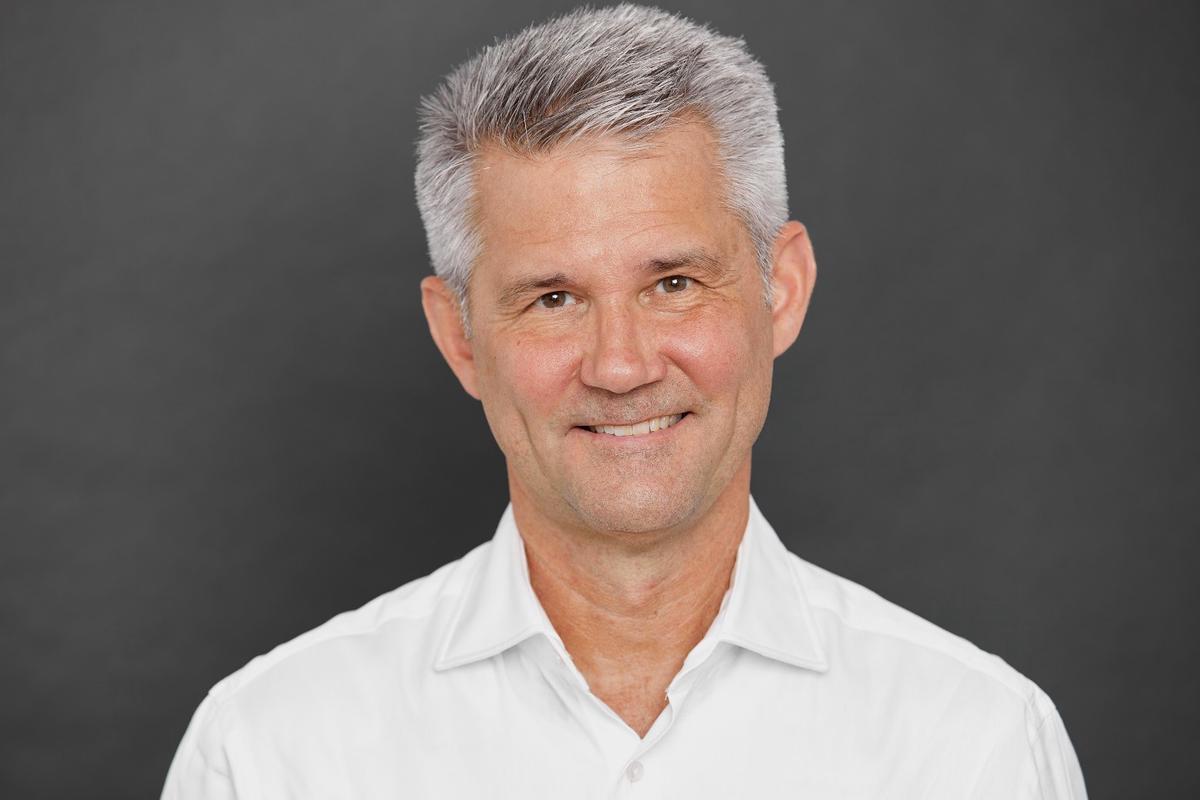 A retouched executive headshot that maintains authenticity while presenting a polished professional image