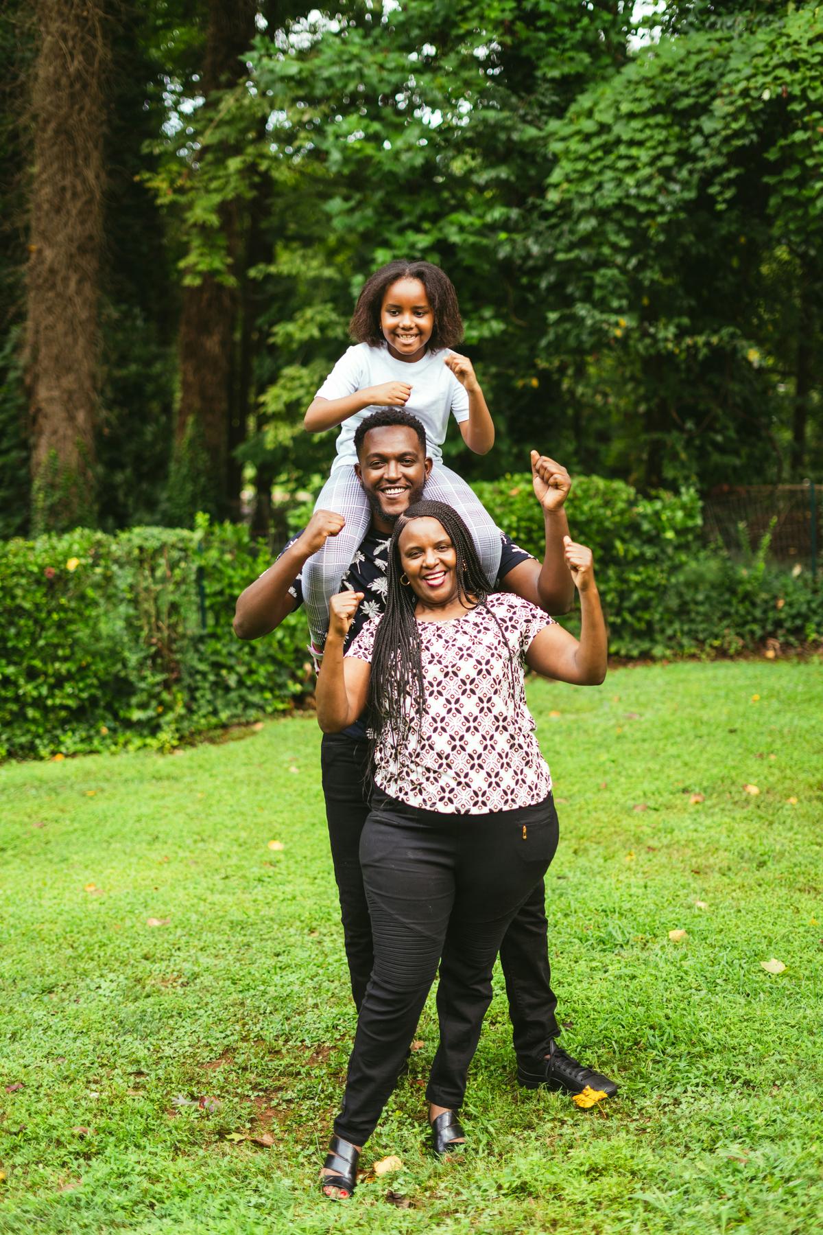 Sarah Thayer capturing a candid family moment in a natural setting