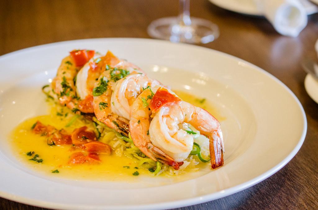 A close-up of a beautifully plated signature dish with intricate details