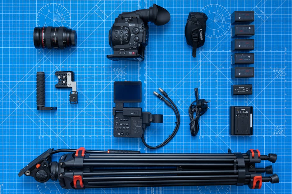 A collection of supporting photography equipment including batteries, memory cards, and color checkers